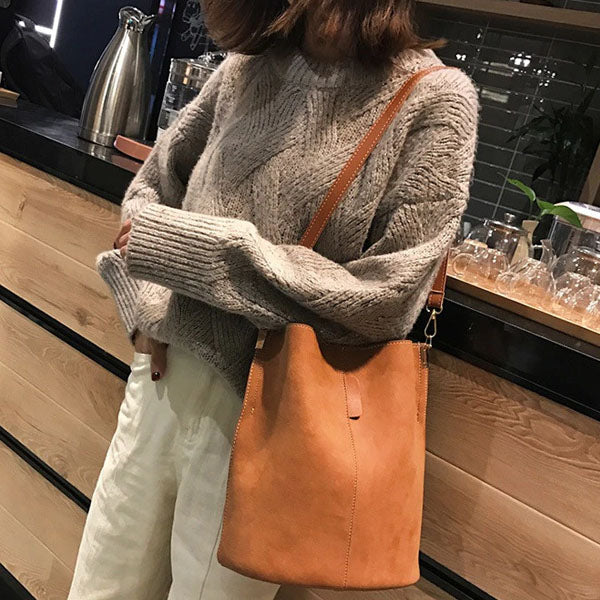 ChristyNg.com - The timeless yet minimalist bucket bag has climbed the  ranks of handbag fame for years due to its utilitarian & chic silhouette.  Double tap to grab yours today.
